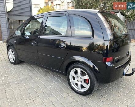 Черный Опель Мерива, объемом двигателя 1.8 л и пробегом 260 тыс. км за 5800 $, фото 6 на Automoto.ua