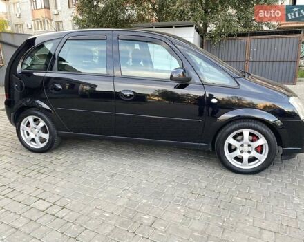 Черный Опель Мерива, объемом двигателя 1.8 л и пробегом 260 тыс. км за 5800 $, фото 11 на Automoto.ua