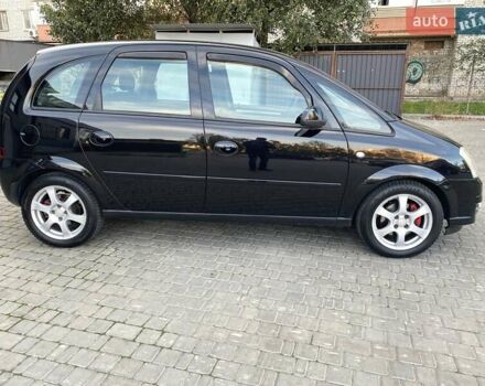 Черный Опель Мерива, объемом двигателя 1.8 л и пробегом 260 тыс. км за 5800 $, фото 12 на Automoto.ua