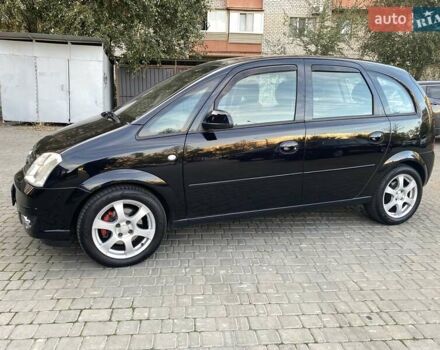 Черный Опель Мерива, объемом двигателя 1.8 л и пробегом 260 тыс. км за 5800 $, фото 2 на Automoto.ua