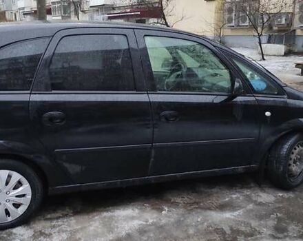 Черный Опель Мерива, объемом двигателя 1.4 л и пробегом 205 тыс. км за 5500 $, фото 8 на Automoto.ua