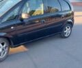 Черный Опель Мерива, объемом двигателя 1.6 л и пробегом 285 тыс. км за 4400 $, фото 4 на Automoto.ua
