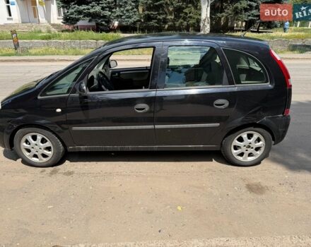 Черный Опель Мерива, объемом двигателя 1.6 л и пробегом 263 тыс. км за 2000 $, фото 1 на Automoto.ua