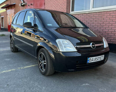 Черный Опель Мерива, объемом двигателя 1.8 л и пробегом 301 тыс. км за 3100 $, фото 1 на Automoto.ua