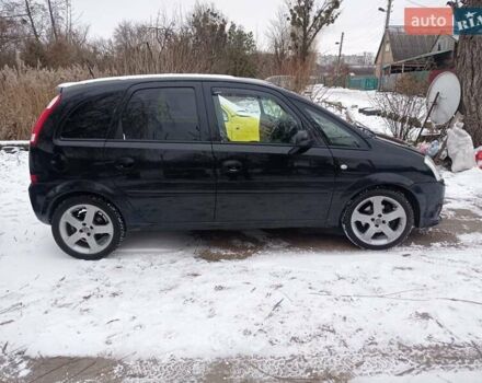 Черный Опель Мерива, объемом двигателя 1.8 л и пробегом 230 тыс. км за 4800 $, фото 1 на Automoto.ua