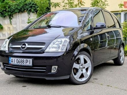 Черный Опель Мерива, объемом двигателя 1.8 л и пробегом 239 тыс. км за 4500 $, фото 1 на Automoto.ua