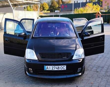 Черный Опель Мерива, объемом двигателя 1.8 л и пробегом 230 тыс. км за 5500 $, фото 1 на Automoto.ua