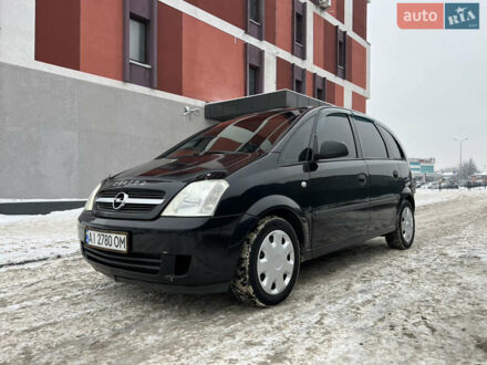 Черный Опель Мерива, объемом двигателя 1.36 л и пробегом 250 тыс. км за 3600 $, фото 1 на Automoto.ua
