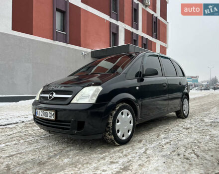 Черный Опель Мерива, объемом двигателя 1.36 л и пробегом 250 тыс. км за 3600 $, фото 1 на Automoto.ua