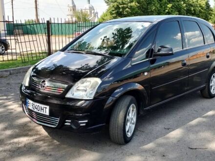 Черный Опель Мерива, объемом двигателя 1.6 л и пробегом 310 тыс. км за 3900 $, фото 1 на Automoto.ua