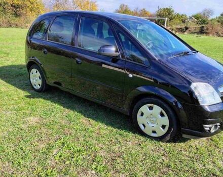 Черный Опель Мерива, объемом двигателя 1.36 л и пробегом 184 тыс. км за 5000 $, фото 1 на Automoto.ua