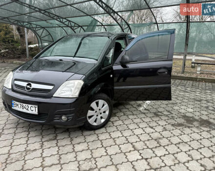 Черный Опель Мерива, объемом двигателя 1.6 л и пробегом 175 тыс. км за 4250 $, фото 1 на Automoto.ua