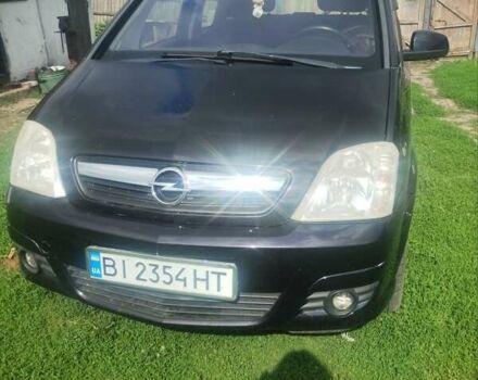 Черный Опель Мерива, объемом двигателя 1.3 л и пробегом 213 тыс. км за 5000 $, фото 1 на Automoto.ua
