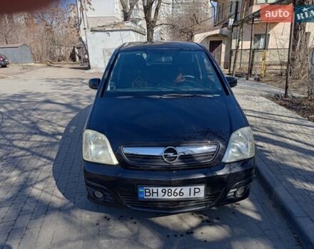 Черный Опель Мерива, объемом двигателя 1.69 л и пробегом 222 тыс. км за 4900 $, фото 1 на Automoto.ua