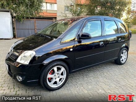 Черный Опель Мерива, объемом двигателя 1.8 л и пробегом 260 тыс. км за 5800 $, фото 1 на Automoto.ua