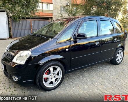 Черный Опель Мерива, объемом двигателя 1.8 л и пробегом 260 тыс. км за 5800 $, фото 1 на Automoto.ua