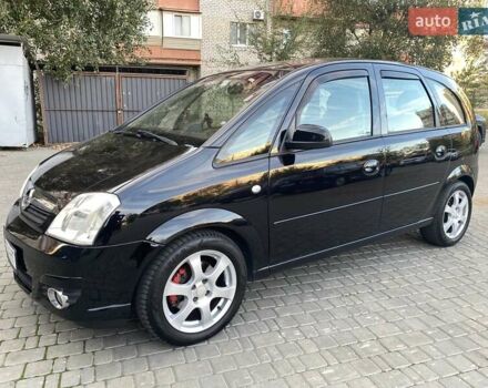 Черный Опель Мерива, объемом двигателя 1.8 л и пробегом 260 тыс. км за 5800 $, фото 1 на Automoto.ua