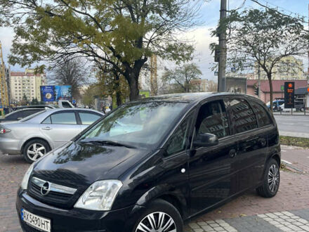 Черный Опель Мерива, объемом двигателя 1.6 л и пробегом 255 тыс. км за 4199 $, фото 1 на Automoto.ua