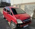 Красный Опель Мерива, объемом двигателя 1.7 л и пробегом 300 тыс. км за 2700 $, фото 1 на Automoto.ua