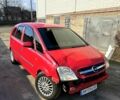 Красный Опель Мерива, объемом двигателя 1.7 л и пробегом 300 тыс. км за 2700 $, фото 1 на Automoto.ua
