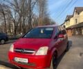Красный Опель Мерива, объемом двигателя 1.69 л и пробегом 369 тыс. км за 3200 $, фото 1 на Automoto.ua