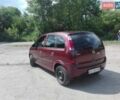 Красный Опель Мерива, объемом двигателя 1.6 л и пробегом 214 тыс. км за 4500 $, фото 1 на Automoto.ua