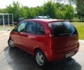 Красный Опель Мерива, объемом двигателя 1.7 л и пробегом 282 тыс. км за 4000 $, фото 1 на Automoto.ua