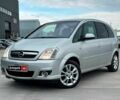 Красный Опель Мерива, объемом двигателя 1.8 л и пробегом 244 тыс. км за 3990 $, фото 1 на Automoto.ua