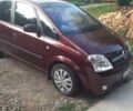 Красный Опель Мерива, объемом двигателя 1.8 л и пробегом 174 тыс. км за 4600 $, фото 1 на Automoto.ua