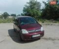 Красный Опель Мерива, объемом двигателя 1.6 л и пробегом 214 тыс. км за 4500 $, фото 1 на Automoto.ua