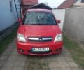 Красный Опель Мерива, объемом двигателя 1.7 л и пробегом 313 тыс. км за 4222 $, фото 1 на Automoto.ua