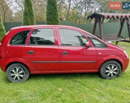 Красный Опель Мерива, объемом двигателя 1.6 л и пробегом 251 тыс. км за 3999 $, фото 1 на Automoto.ua