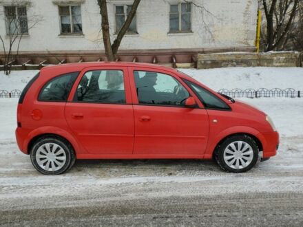 Красный Опель Мерива, объемом двигателя 1.7 л и пробегом 288 тыс. км за 4000 $, фото 1 на Automoto.ua