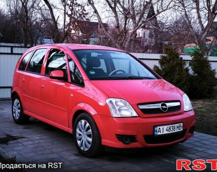 Красный Опель Мерива, объемом двигателя 1.7 л и пробегом 290 тыс. км за 3900 $, фото 1 на Automoto.ua