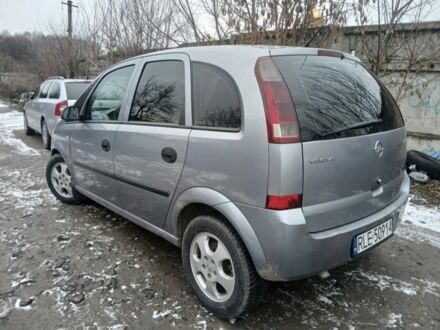 Серый Опель Мерива, объемом двигателя 1.7 л и пробегом 321 тыс. км за 1000 $, фото 1 на Automoto.ua