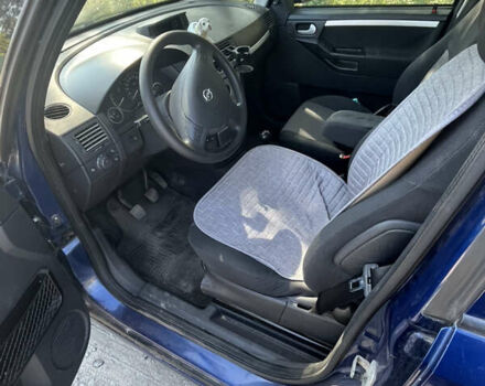 Синий Опель Мерива, объемом двигателя 1.8 л и пробегом 248 тыс. км за 4300 $, фото 4 на Automoto.ua