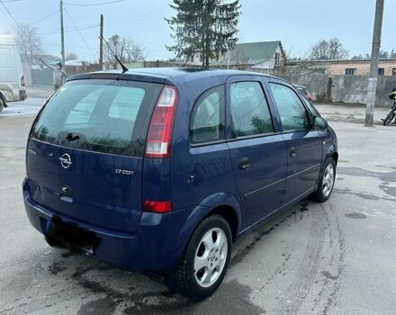 Синий Опель Мерива, объемом двигателя 1.7 л и пробегом 269 тыс. км за 1750 $, фото 2 на Automoto.ua