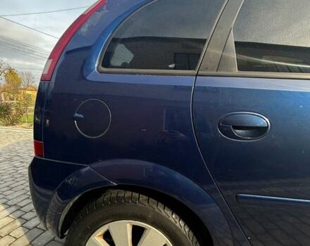 Синий Опель Мерива, объемом двигателя 1.69 л и пробегом 253 тыс. км за 3850 $, фото 4 на Automoto.ua