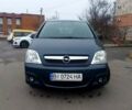 Синий Опель Мерива, объемом двигателя 1.6 л и пробегом 250 тыс. км за 4100 $, фото 1 на Automoto.ua