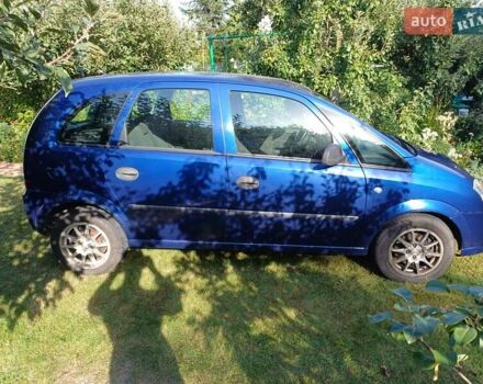 Синий Опель Мерива, объемом двигателя 1.6 л и пробегом 254 тыс. км за 4200 $, фото 5 на Automoto.ua
