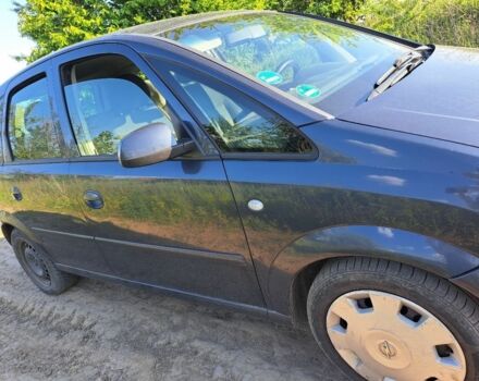 Синий Опель Мерива, объемом двигателя 1.2 л и пробегом 270 тыс. км за 3200 $, фото 2 на Automoto.ua