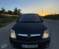 Синий Опель Мерива, объемом двигателя 1.69 л и пробегом 262 тыс. км за 3550 $, фото 6 на Automoto.ua