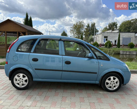 Синий Опель Мерива, объемом двигателя 1.69 л и пробегом 260 тыс. км за 4500 $, фото 2 на Automoto.ua
