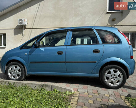 Синий Опель Мерива, объемом двигателя 1.69 л и пробегом 260 тыс. км за 4500 $, фото 6 на Automoto.ua