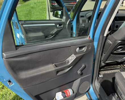 Синий Опель Мерива, объемом двигателя 1.69 л и пробегом 260 тыс. км за 4500 $, фото 13 на Automoto.ua