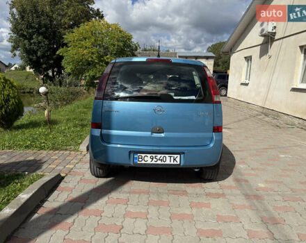 Синий Опель Мерива, объемом двигателя 1.69 л и пробегом 260 тыс. км за 4500 $, фото 4 на Automoto.ua