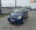 Синий Опель Мерива, объемом двигателя 1.3 л и пробегом 303 тыс. км за 5000 $, фото 1 на Automoto.ua
