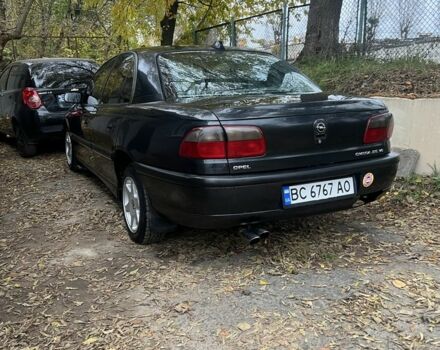Черный Опель Омега, объемом двигателя 2.5 л и пробегом 200 тыс. км за 2600 $, фото 2 на Automoto.ua