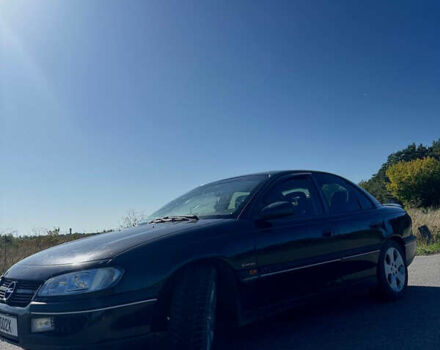 Черный Опель Омега, объемом двигателя 2.5 л и пробегом 470 тыс. км за 2400 $, фото 2 на Automoto.ua