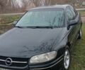 Черный Опель Омега, объемом двигателя 2.5 л и пробегом 268 тыс. км за 850 $, фото 1 на Automoto.ua
